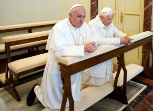 Benedict Francis kneeling